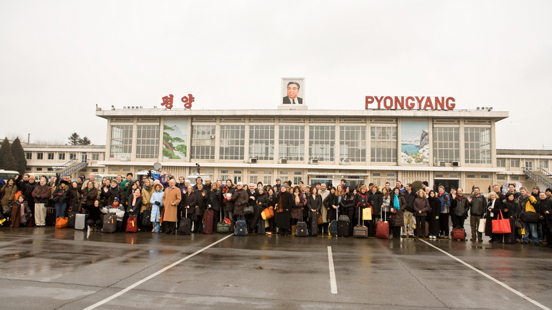 The orchestra arrives at Pyongyang airport | Copyright: © Chris Lee